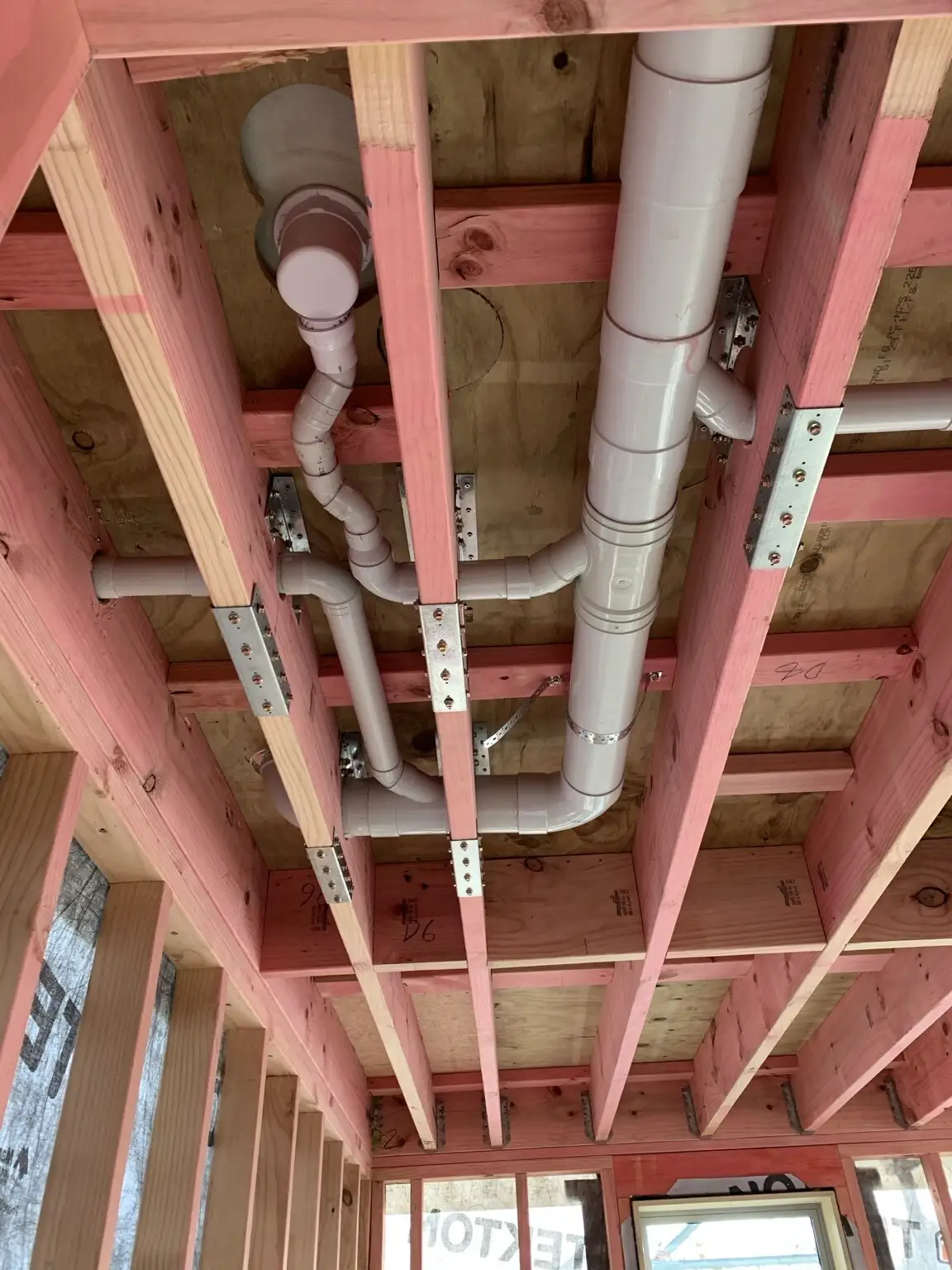 Waste pipework roughed in through floor framing