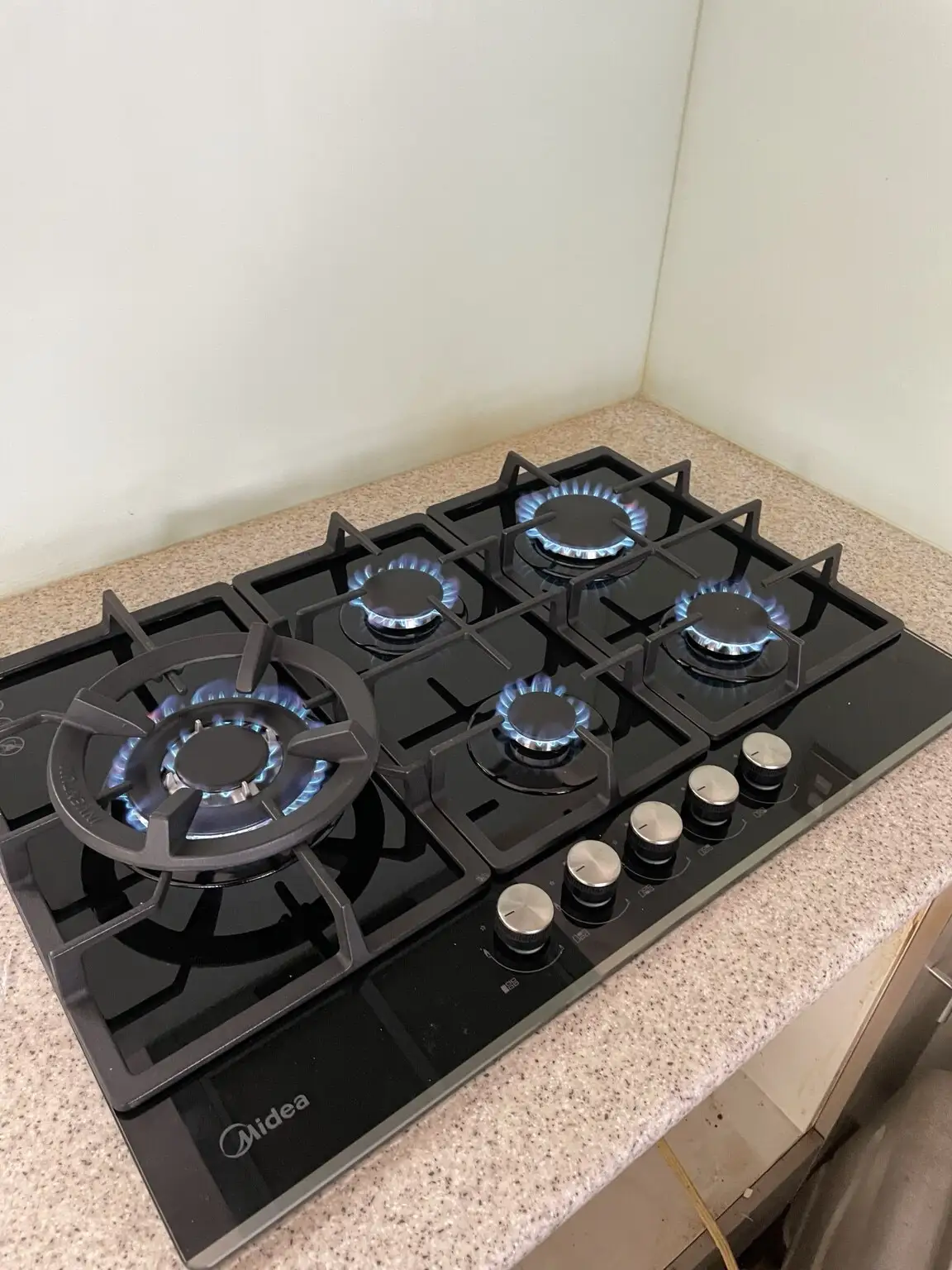 Gas hob burning with clean blue flames